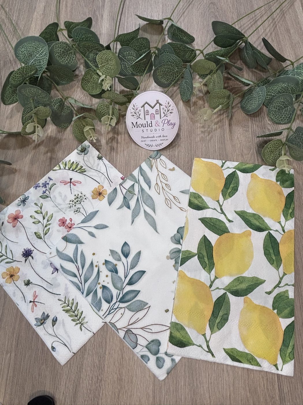 Three decoupage paper designs
